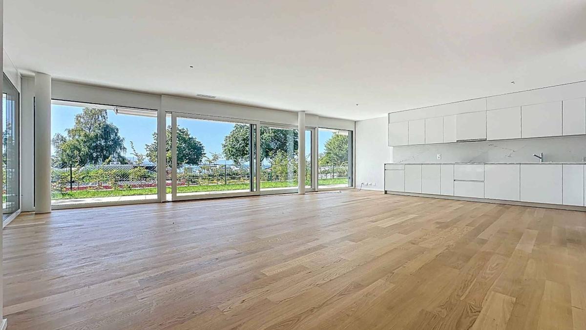 Exceptionnel 5.5 pièces au rez-de-chaussée avec terrasse et jardin privatif vue lac